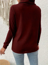 Deep maroon ribbed knit turtleneck long sleeve sweater with decorative buttons
