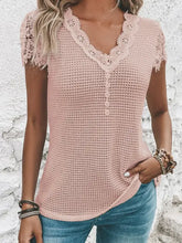 Women’s pink waffle knit short sleeve top with decorative button V-neck