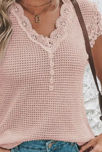 Light pink short sleeve waffle knit top with decorative button V-neck