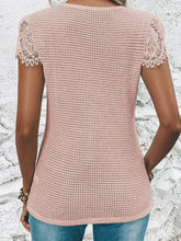 Light pink waffle knit V-neck T-shirt with decorative button and short sleeve lace sleeves