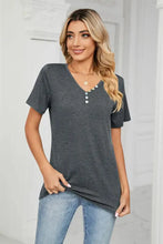 Woman’s dark gray V-neck short-sleeve t-shirt with decorative buttons