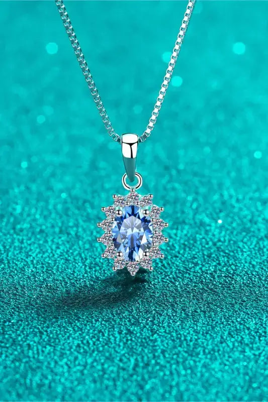 Delicate 1 carat moissanite necklace with oval blue gem and halo stones