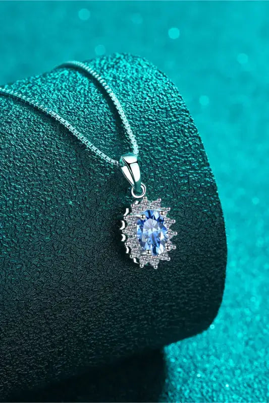 Delicate 1 carat moissanite necklace with oval blue gem halo