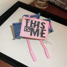 Pink denim tote bag with acrylic braided rope handles and hair claw clips