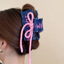 Denim ponytail holder with pink accents and acrylic braided rope hair claw clip