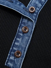 Black ribbed henley shirt featuring denim trim button detail and brown four-hole buttons for stylish layering