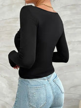 Devine Twisted long sleeve black V-neck bodysuit with distressed jeans