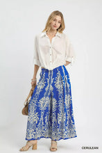 Umgee border print wide leg pants in blue and white featuring a comfortable flowy fabric perfect for casual wear