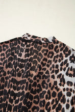 Leopard wrapped V-neck slim short sleeve top with black and brown spots on white background