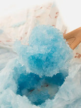 Disposable female pet diapers with icy blue shaved ice on wooden spoon