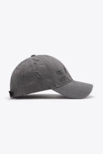 Distressed adjustable baseball cap in dark grey with curved brim