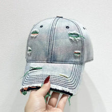 Light blue distressed adjustable baseball cap with frayed edges