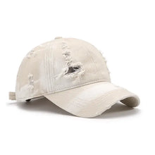 Distressed adjustable cotton baseball cap with ripped beige accents