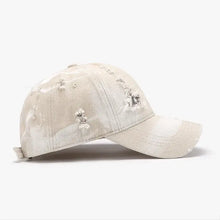 Distressed off-white adjustable cotton baseball cap with curved brim