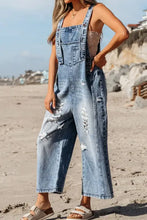 Distressed bib pocket wide leg denim overalls in light wash