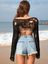 Women’s distressed boat neck long sleeve cover up with slightly stretchy knit over bralette and denim shorts