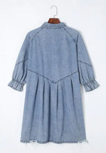 Light blue denim dress with distressed collared neck and three-quarter length collared neck flounce sleeves