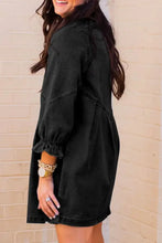 Black denim dress with puffed sleeves and ruffled cuff featuring distressed collared neck flounce design