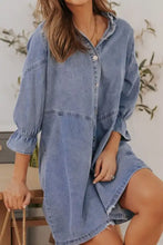 Light blue denim dress with distressed collared neck, button-front design, puffed flounce sleeves, and asymmetrical hemline