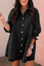 Black denim dress with distressed collared neck flounce sleeves and white buttons in a button-down style