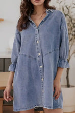 A light-wash denim dress with a distressed collared neck and collared neck flounce three-quarter sleeves and relaxed fit