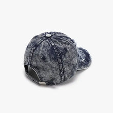 Distressed cotton baseball cap with acid-wash denim and adjustable clasp