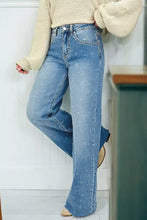 Light-wash denim tummy control raw hem jeans with flare cut subtle dotted texture and classic five-pocket design