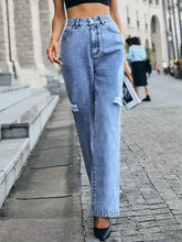 Light-wash denim distressed high waist jeans with high-rise wide-leg fit and ripped knees