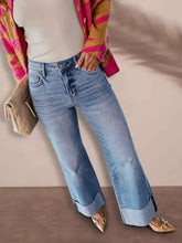 Distressed high-waisted light-wash denim flare jeans with rolled cuffs and subtle distressing for perfect fit and best results