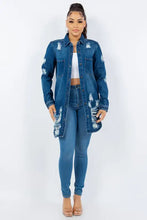 Distressed long sleeve denim jacket for women in medium blue with frayed edges