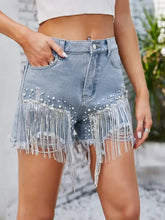 Distressed pearl trim denim shorts with pockets and fringe