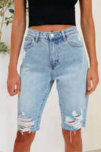 Light wash distressed pocketed denim shorts with pockets