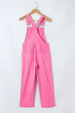 Pink distressed pocketed wide strap denim overalls with frayed hems