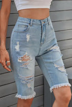 Distressed raw hem denim bermuda shorts with frayed edges