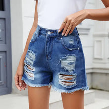 Distressed raw hem denim shorts in slightly stretchy blue denim