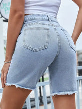 Light wash high-waisted raw hem denim shorts