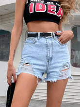 Distressed raw hem denim shorts in light wash with ripped details and black belt