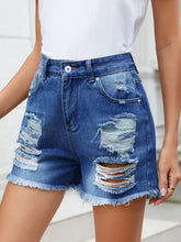 Distressed raw hem denim shorts in slightly stretchy denim