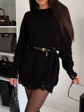 Black ribbed knit sweater dress with lace trim and distressed cuffs