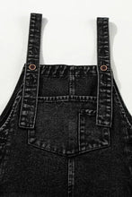 Distressed wide strap denim overalls with cropped legs and pockets