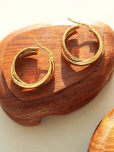 Two 18k gold-plated titanium steel huggie earrings with double-band design