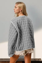 Grey quilted jacket with contrast trim and frayed hem