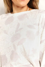 A soft white double take floral long sleeve top and shorts loungewear set with muted lavender floral pattern and textured fabric