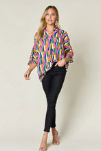 Double take full size geometric notched dolman sleeve top in vibrant purple green yellow and orange hues for jeans size