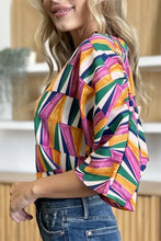 A vibrant double take full size geometric notched dolman sleeve blouse in pink green orange and white ideal for jeans size