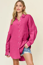 A vibrant fuchsia double take full size pocketed texture button up shirt with long sleeves and relaxed fit fabric