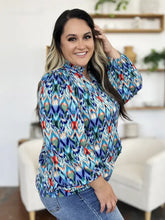 Double take full size printed balloon sleeve blouse with vibrant long sleeves and bold geometric pattern in blue teal red and green
