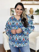 Double take full size printed balloon sleeve blouse in vibrant blue red and green ikat pattern with v neckline