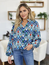 Double Take full size printed balloon sleeve blouse in vibrant blue red and teal ikat pattern with long puffed sleeves