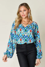 Double Take full size printed balloon sleeve blouse with vibrant blue green ikat pattern and red accents long sleeves